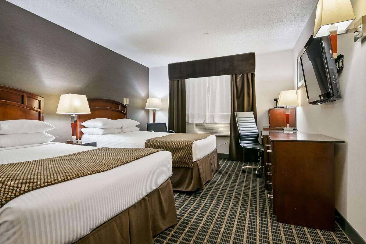 Desk, blackout drapes, iron/ironing board, rollaway beds