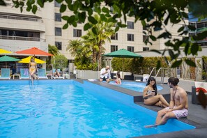 Outdoor pool, open 6:00 AM to 10:00 PM, pool umbrellas, sun loungers