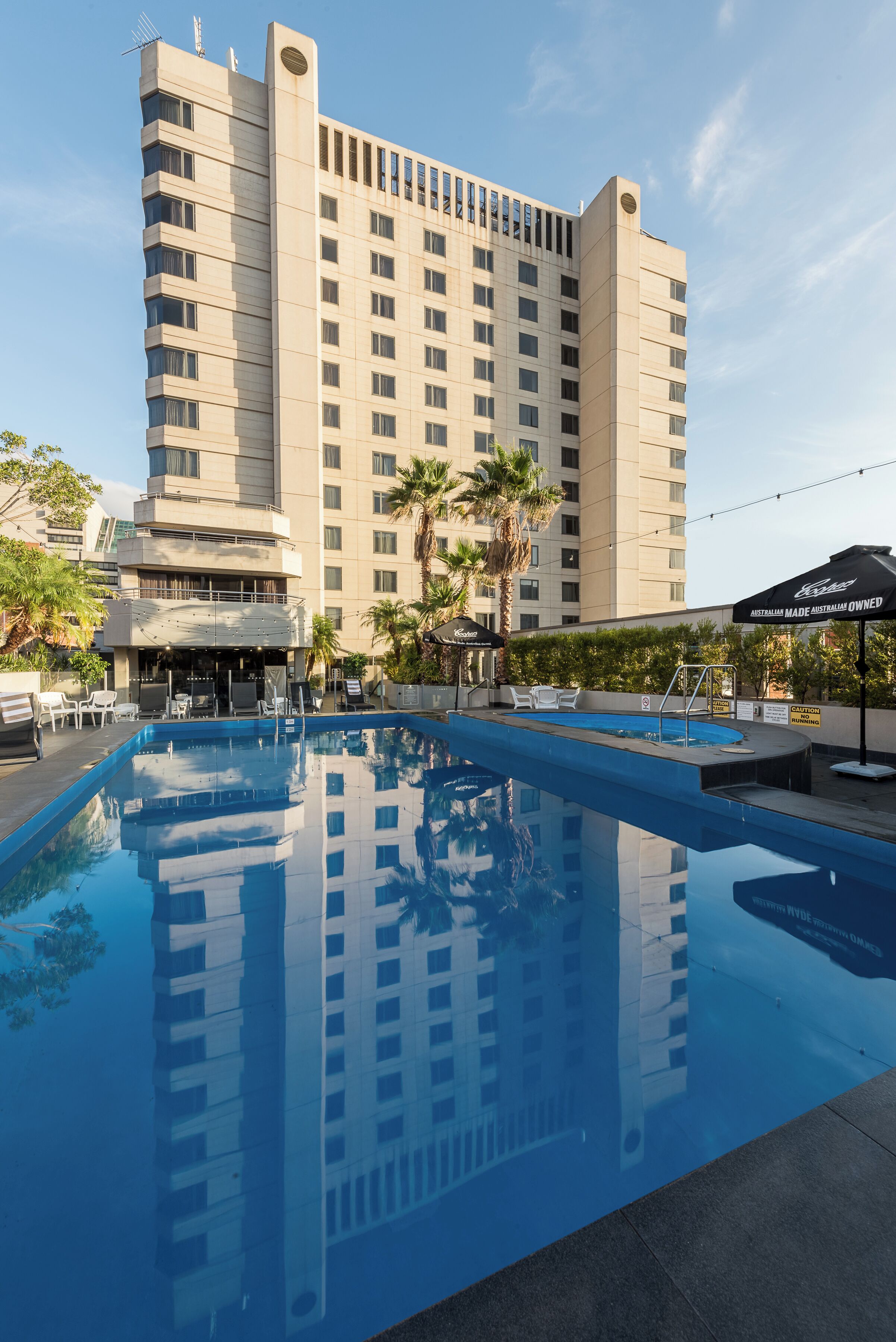 Outdoor pool, open 6:00 AM to 10:00 PM, pool umbrellas, pool loungers
