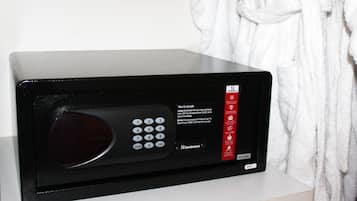 A black microwave with a keypad and instructions on how to use it.