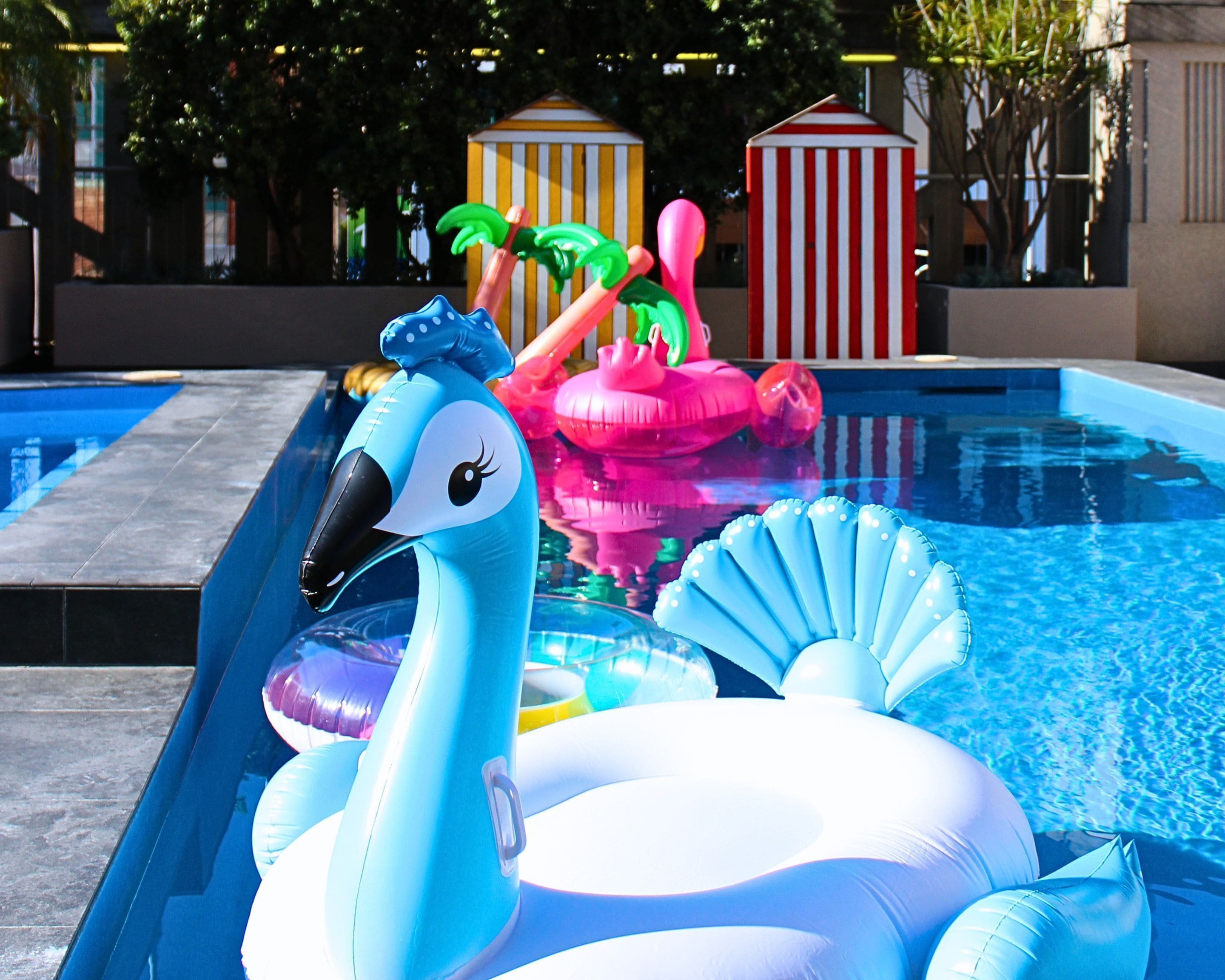 outdoor pool, open 6:00 am to 10:00 pm, pool umbrellas, pool loungers