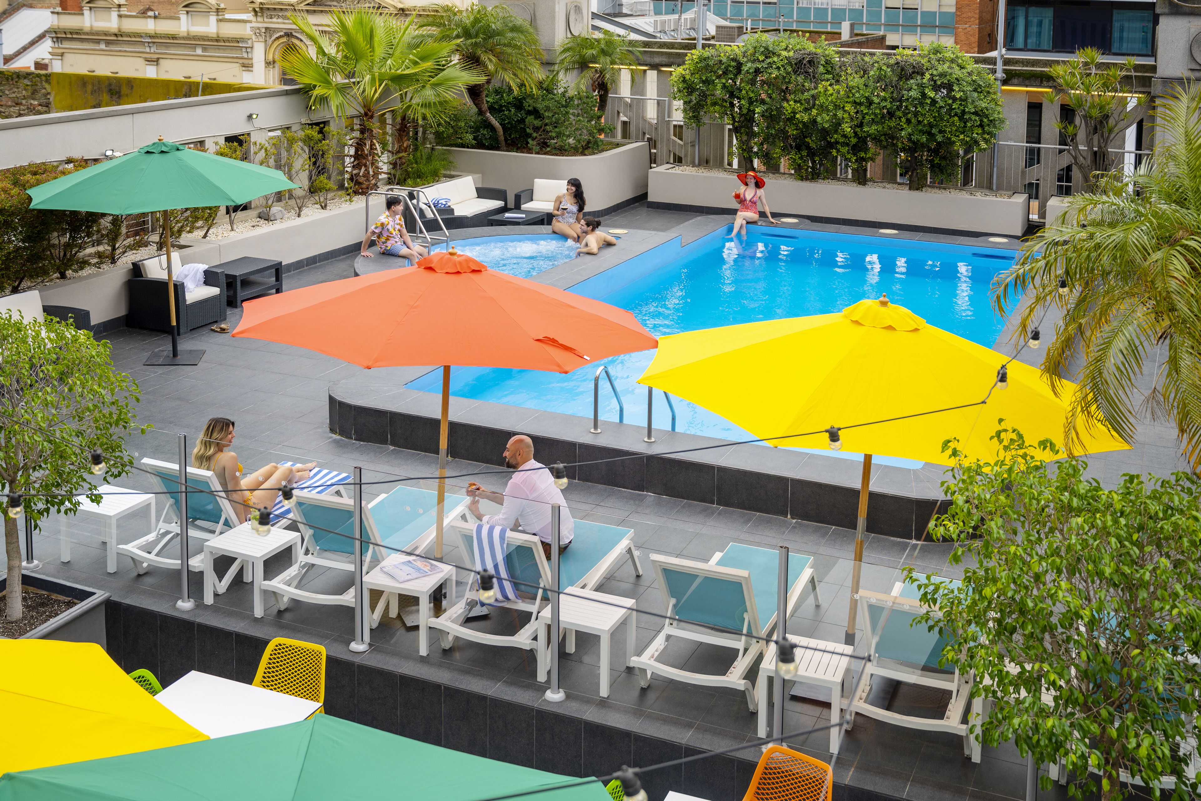 outdoor pool, open 6:00 am to 10:00 pm, pool umbrellas, pool loungers