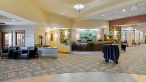 A spacious lobby with a reception desk, seating area, and patterned carpet. - Best Western Plus Loveland Inn (Loveland)