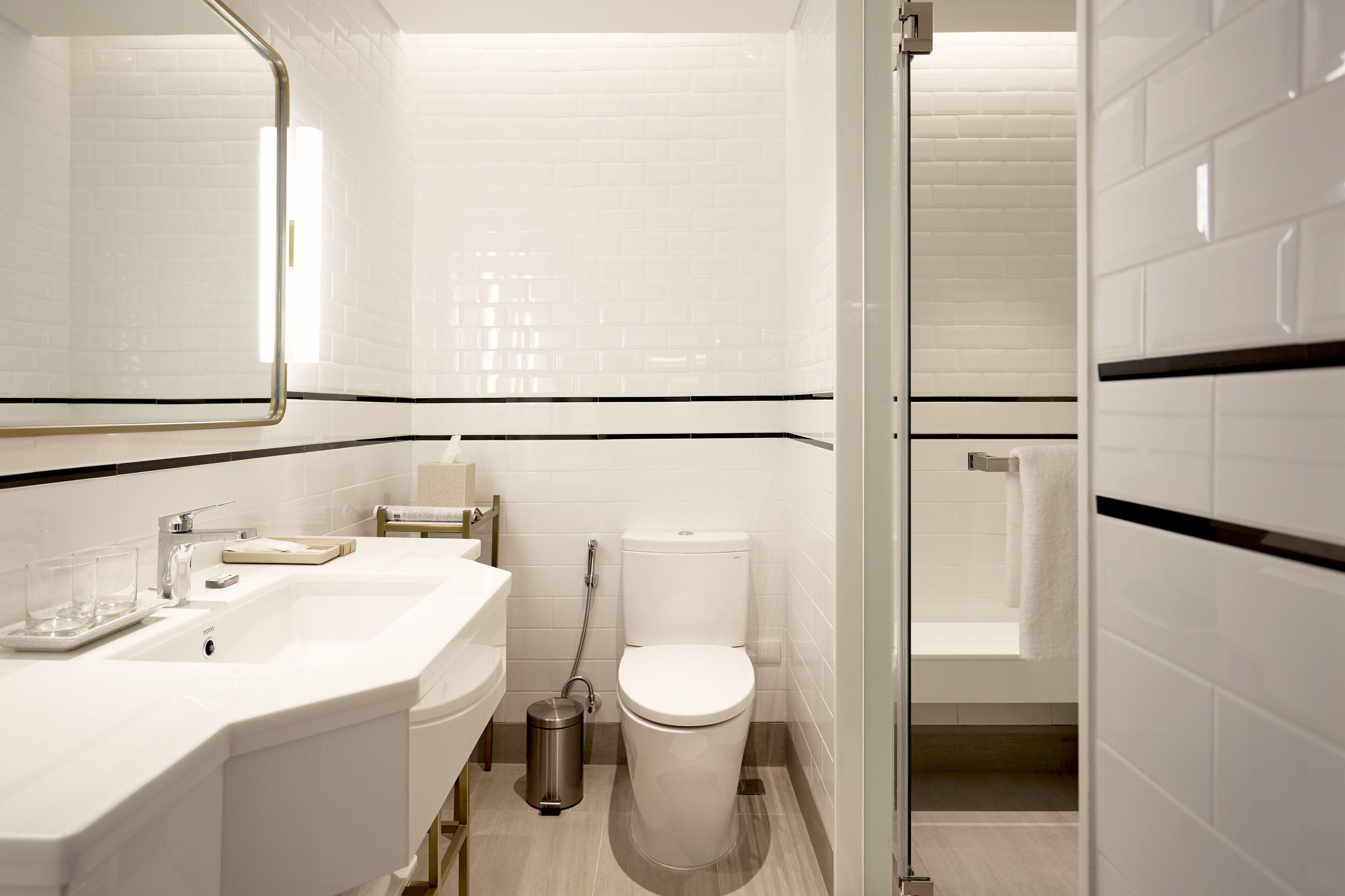 deluxe king room | bathroom | hair dryer, bathrobes, slippers, bidet