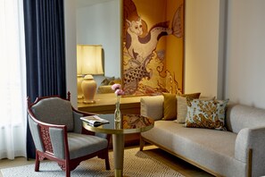 Junior Suite with California King Bed | Living area | 55-inch Smart TV with cable channels, TV