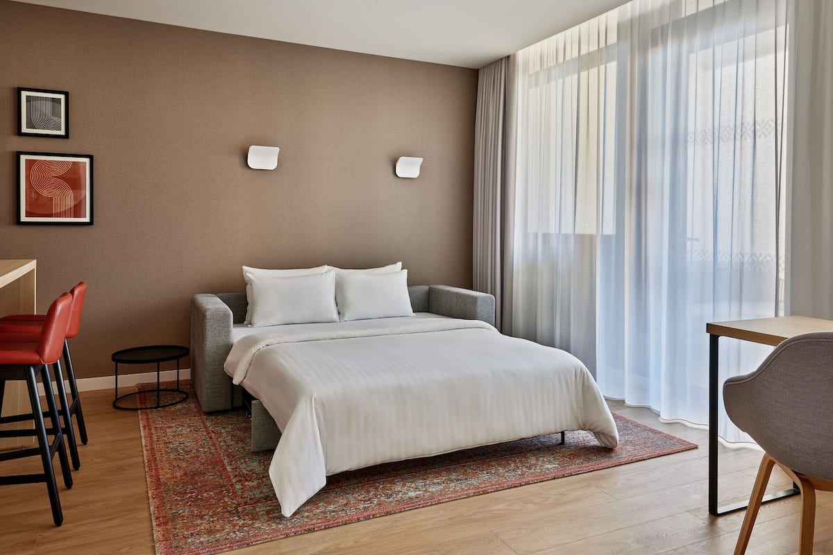 Hypo-allergenic bedding, down comforters, minibar, in-room safe
