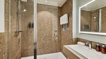 Shower, designer toiletries, hair dryer, slippers
