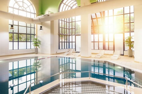 Indoor pool, sun loungers. Crowne Plaza Leeds by IHG
