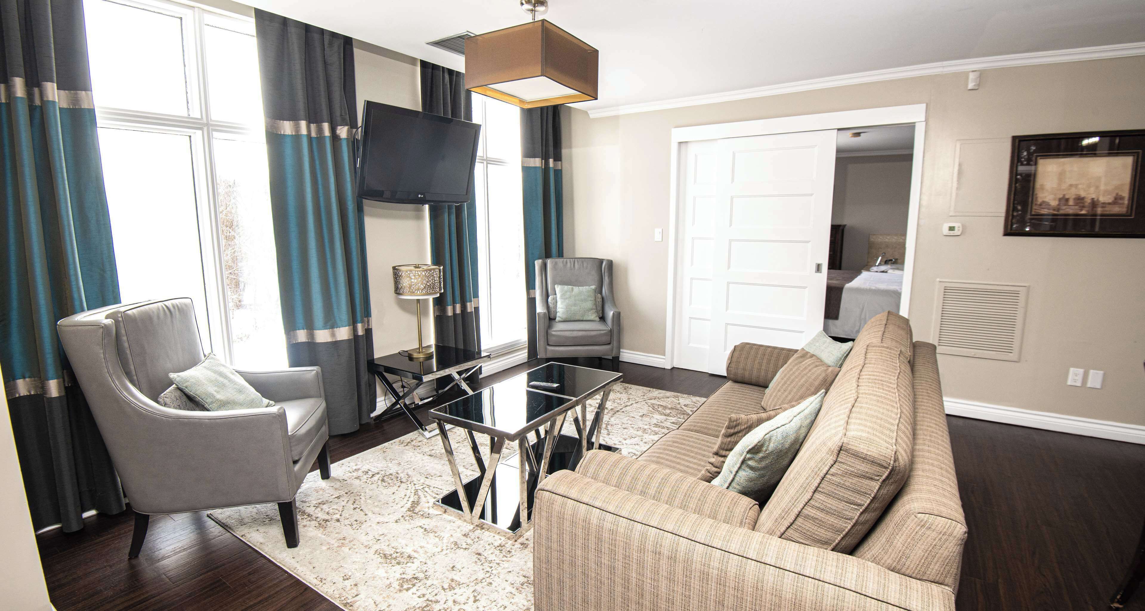 suite, 1 king bed, non smoking, jetted tub (separate living room;with sofabed) | desk, iron/ironing board, free cots/infant beds, free wifi