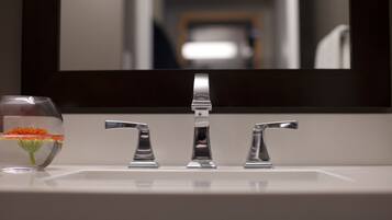 A bathroom sink with a mirror above it.