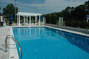 Seasonal outdoor pool, open 10:00 AM to 7:00 PM, pool umbrellas