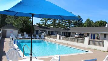 Seasonal outdoor pool, open 10:00 AM to 7:00 PM, pool umbrellas