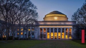 A classical building with a central dome and columns, surrounded by trees. - Four Points by Sheraton Boston Newton (Newton)