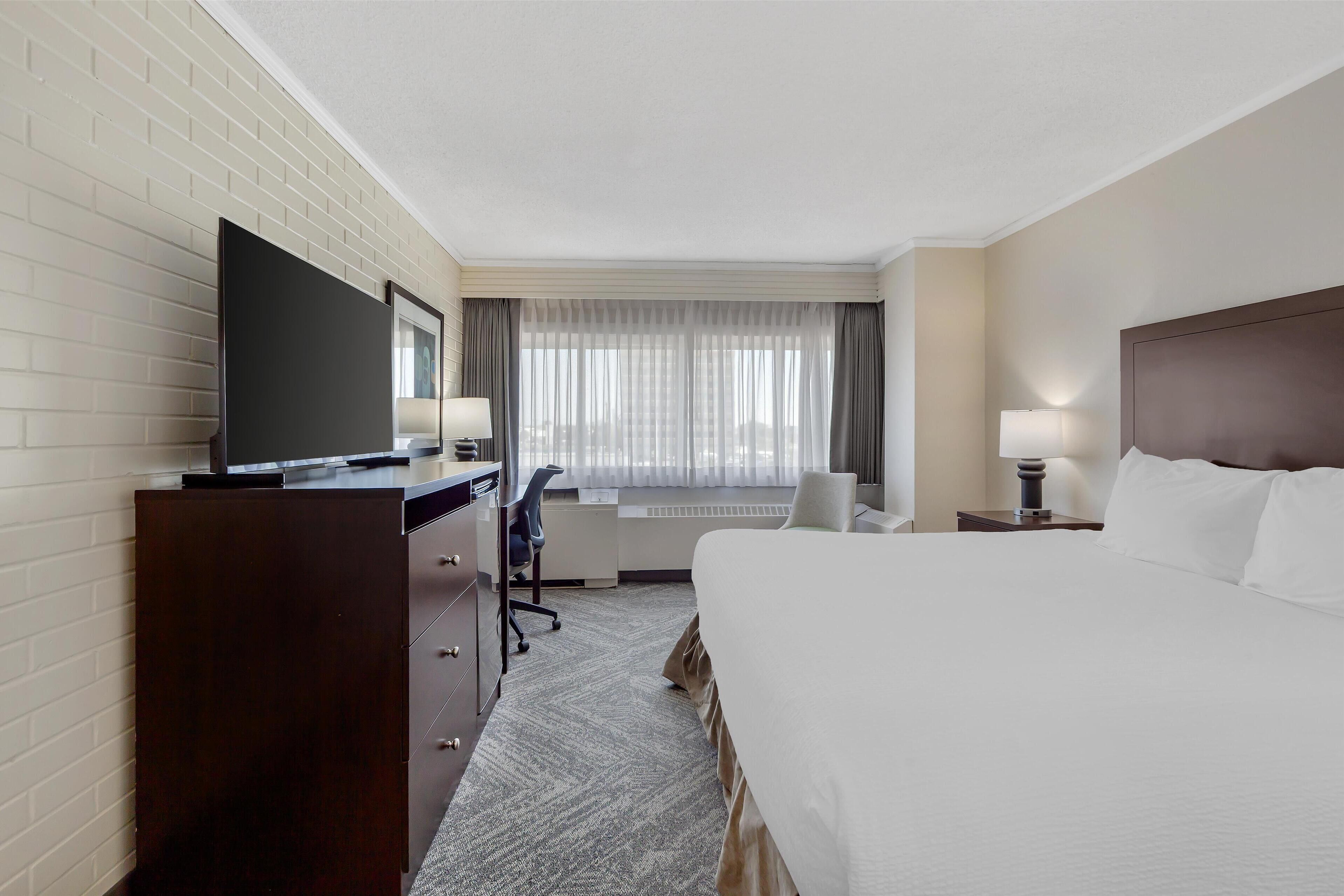 Premium bedding, down comforters, desk, laptop workspace