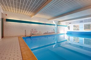 Indoor pool, open 7 AM to 11 PM, pool umbrellas, sun loungers