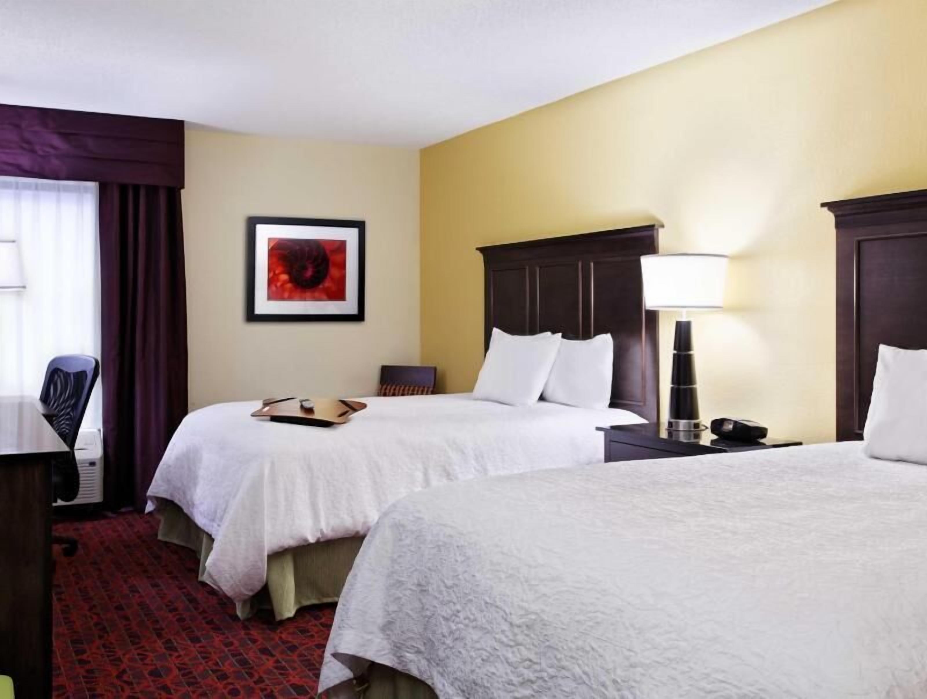 Premium bedding, desk, laptop workspace, blackout curtains