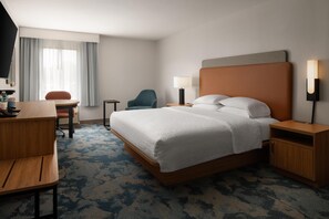 Premium bedding, desk, laptop workspace, blackout curtains