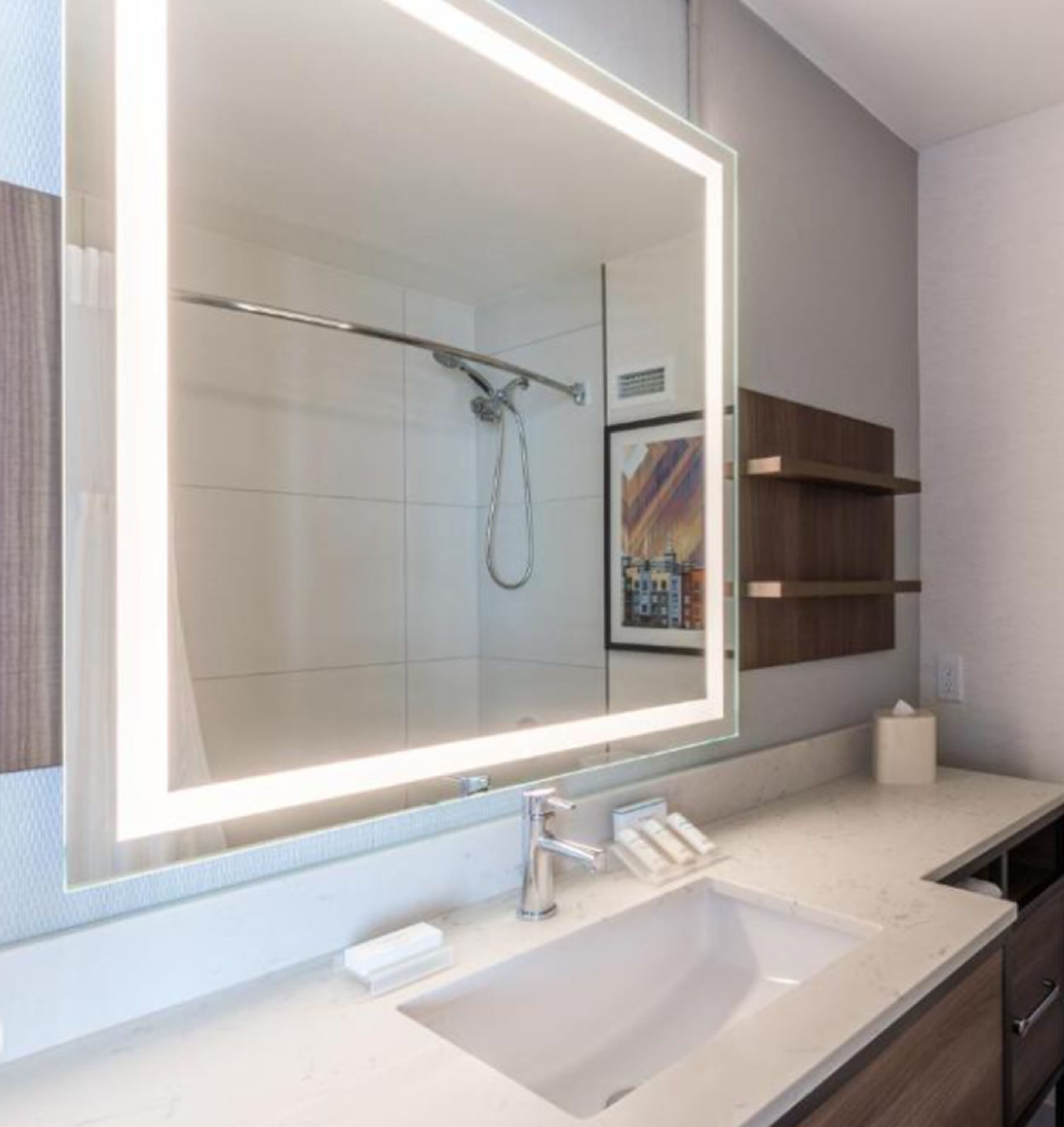 designer toiletries, hair dryer, towels