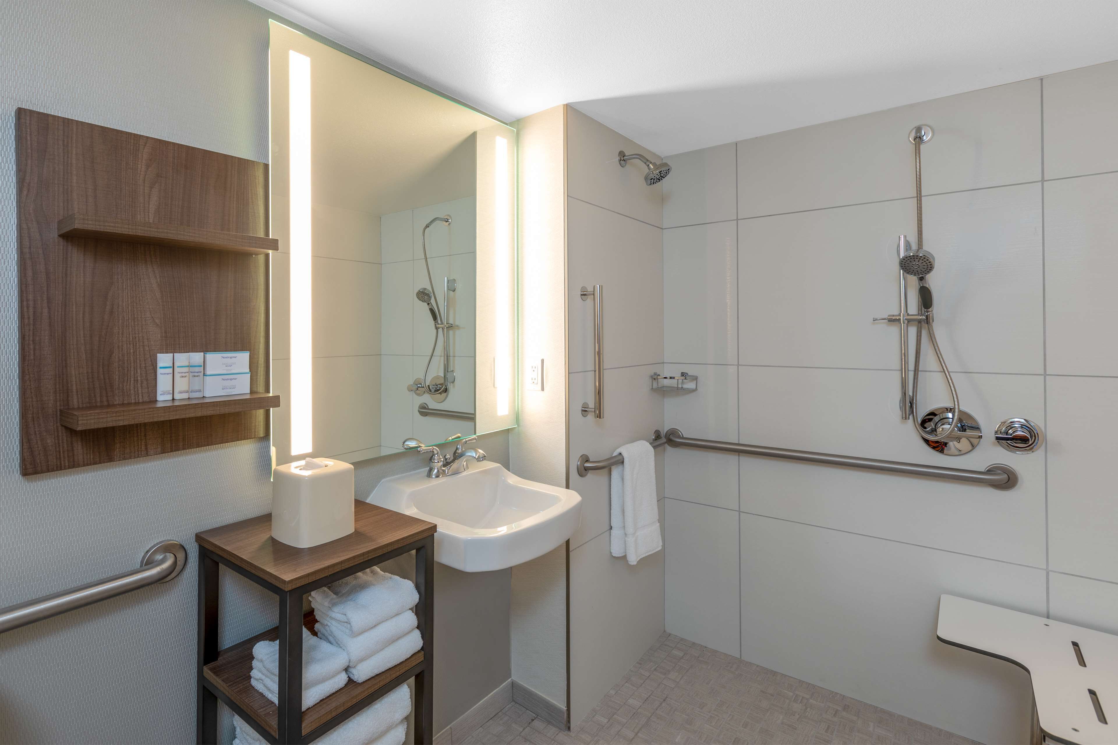 designer toiletries, hair dryer, towels