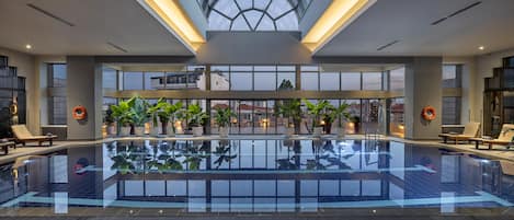 Indoor pool, pool umbrellas, sun loungers