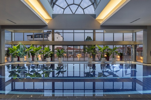 Indoor pool, pool umbrellas, sun loungers