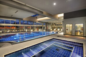 Indoor pool, pool umbrellas, pool loungers