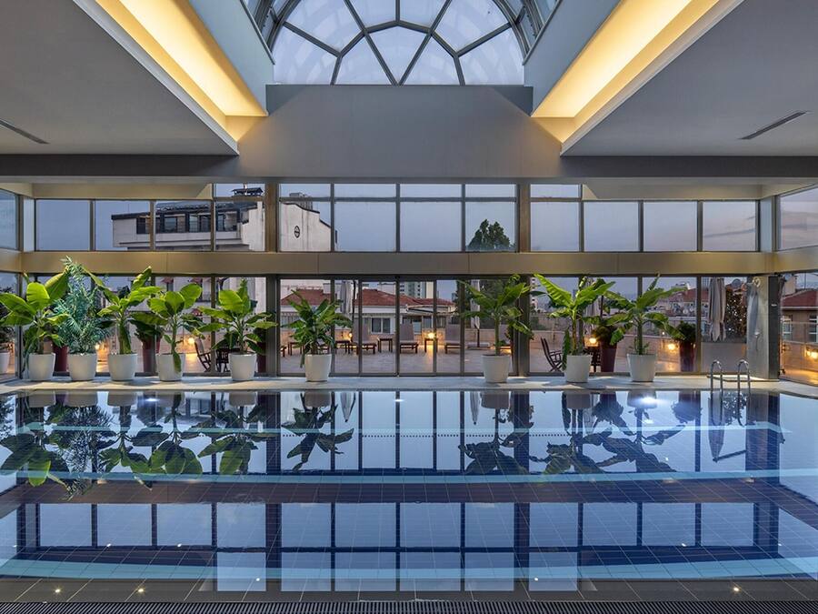 Indoor pool, pool umbrellas, sun loungers