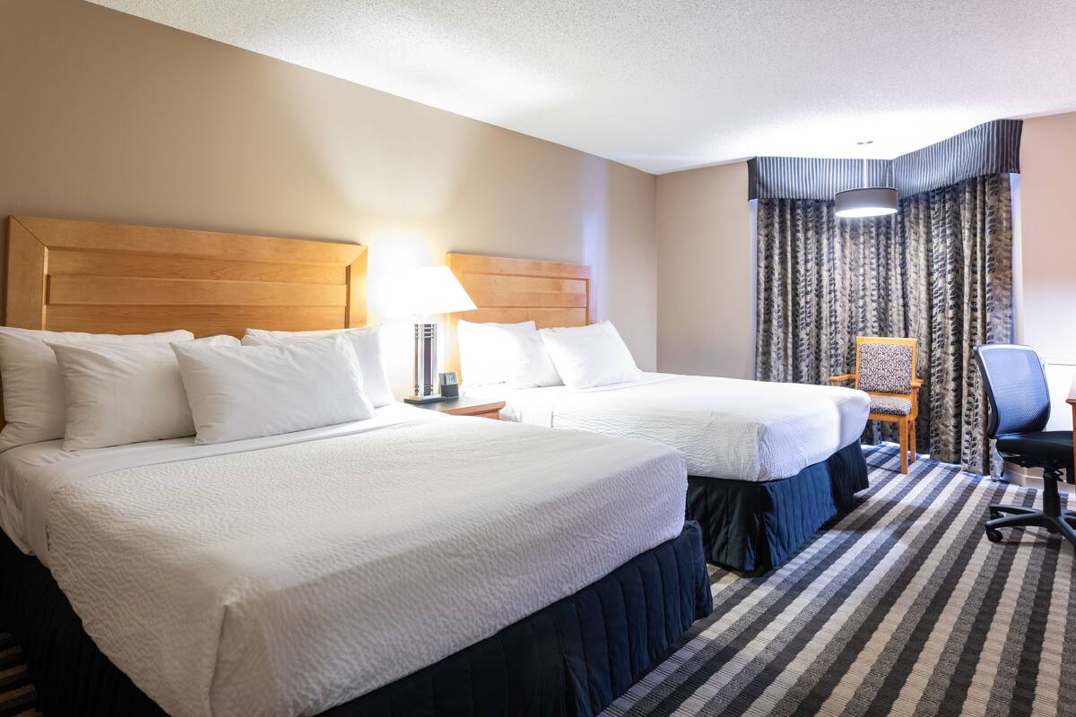 deluxe room, 2 queen beds, non smoking | hypo-allergenic bedding, pillow-top beds, desk, blackout curtains