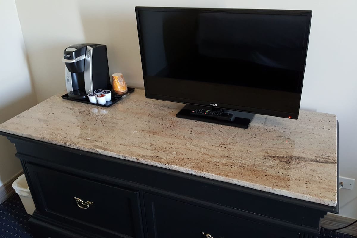 Desk, blackout drapes, iron/ironing board, free cribs/infant beds