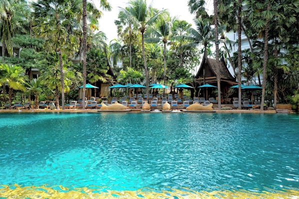 Outdoor pool, open 6:00 AM to 8:00 PM, pool umbrellas