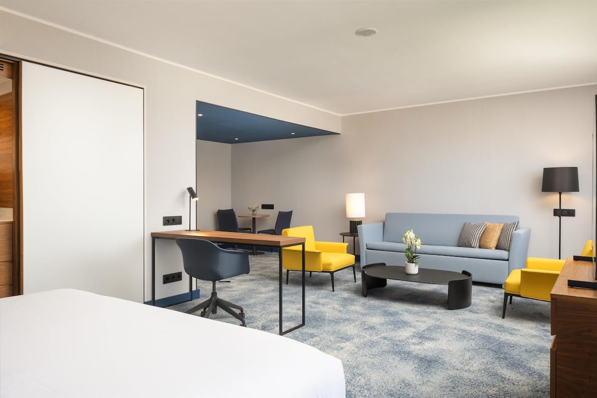 Suite, 1 King Bed with Sofa bed (Alcove) | Living area | 55-inch LCD TV with digital channels