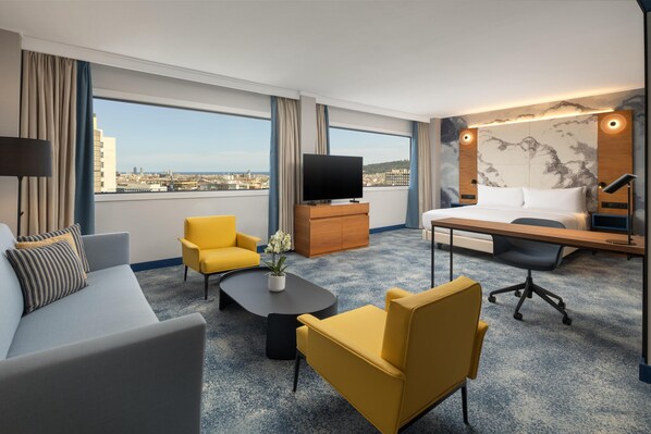 Suite, 1 King Bed with Sofa bed (Alcove) | Living area | 55-inch LCD TV with digital channels