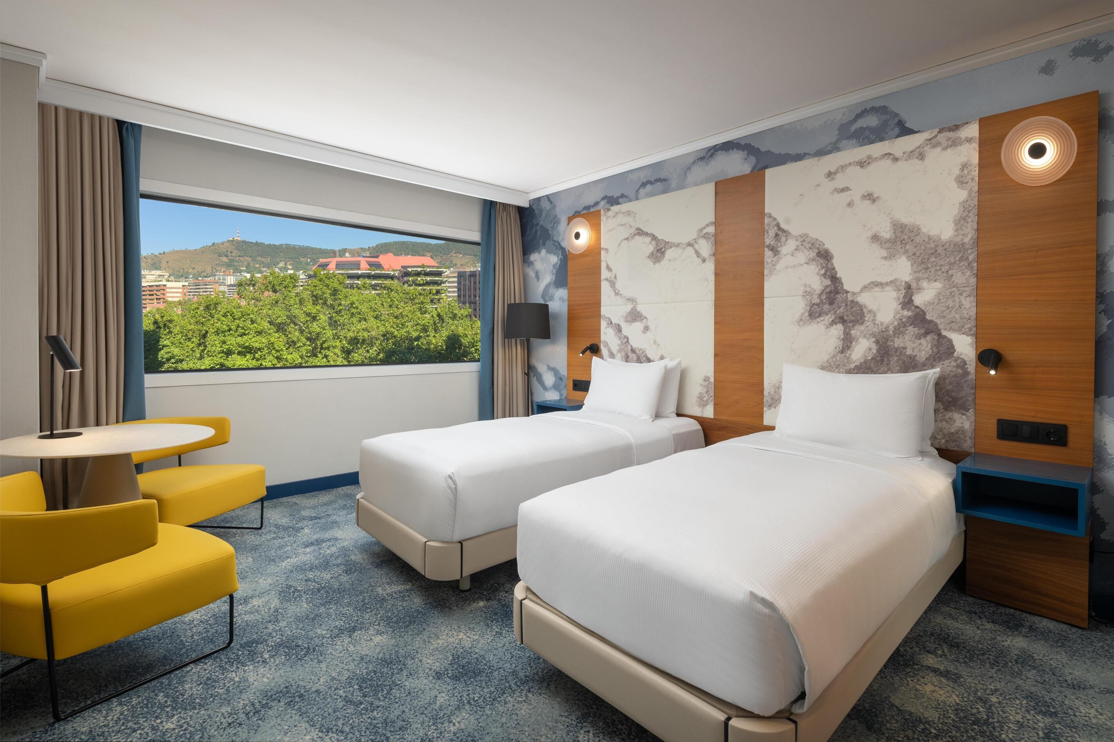 Twin Room | 1 bedroom, down comforters, pillowtop beds, minibar