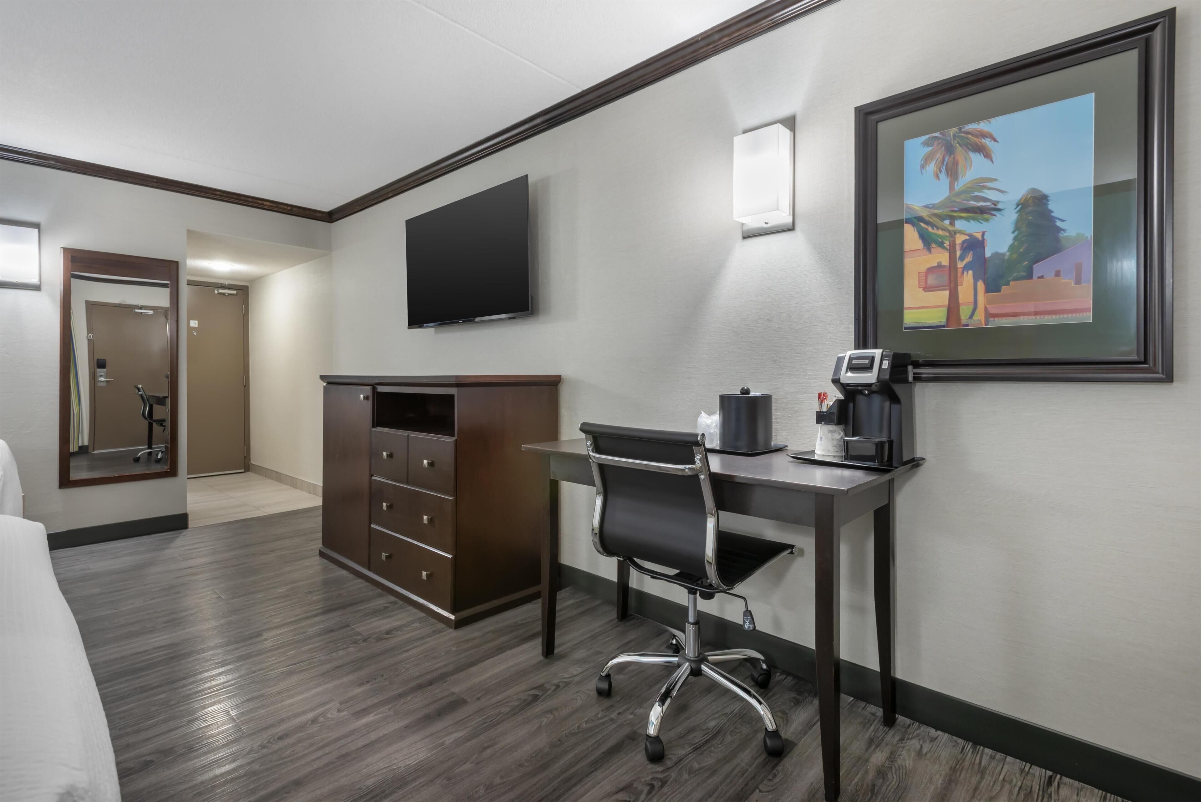 Laptop workspace, blackout drapes, iron/ironing board