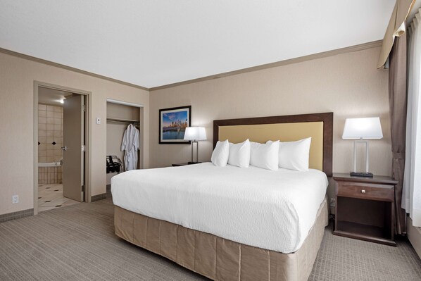 Suite, 1 King Bed, Non Smoking, Jetted Tub (with Sofabed) | Laptop workspace, blackout curtains, iron/ironing board - Best Western Plus Port O'Call Hotel (Calgary)