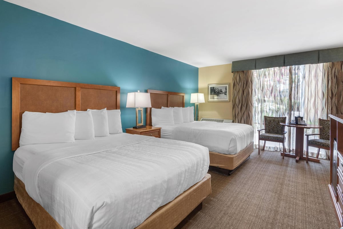Standard Room, 2 Queen Beds, Refrigerator & Microwave, Pool View | Pillowtop beds, in-room safe, blackout drapes, iron/ironing board