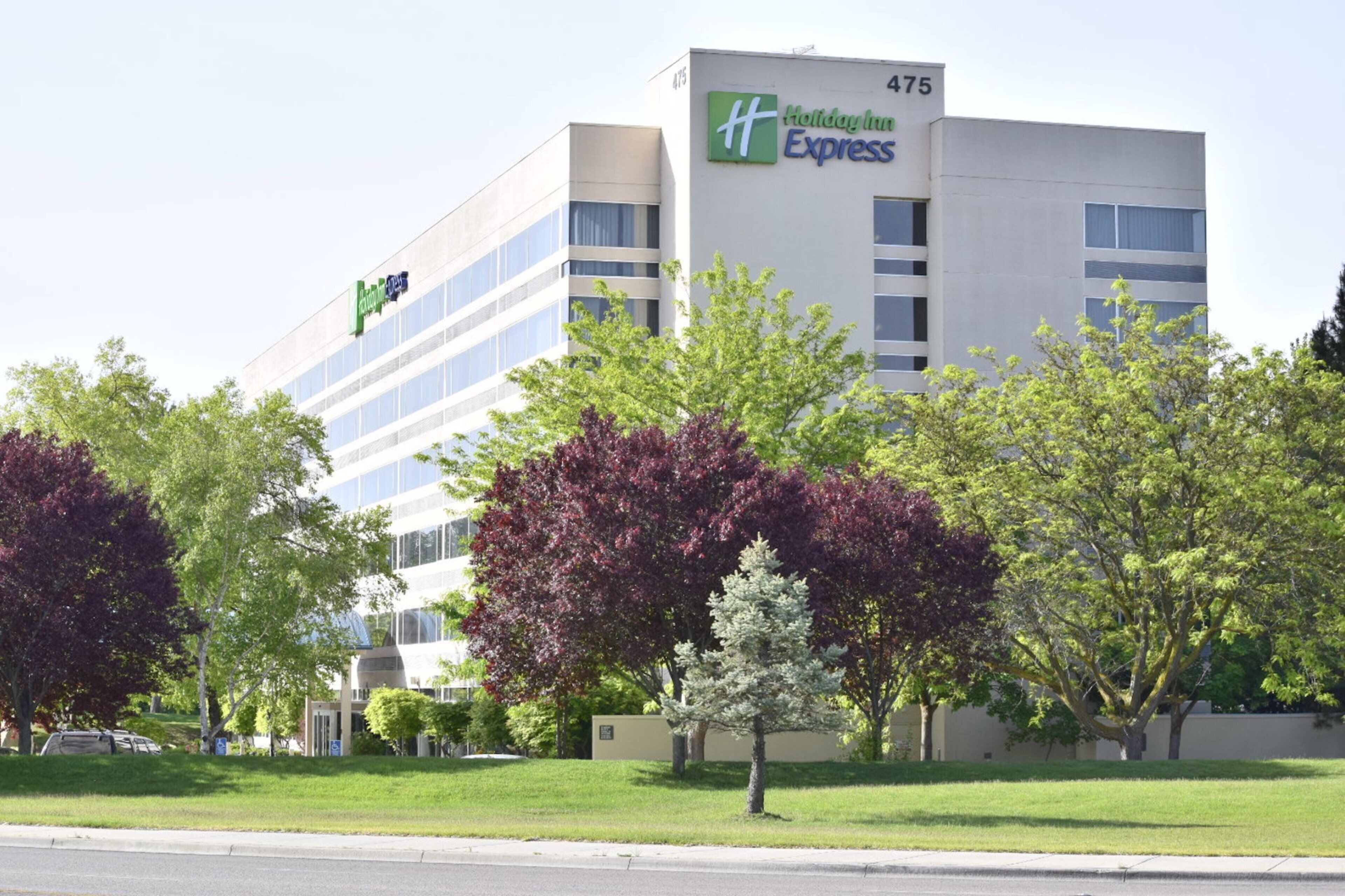 A Holiday Inn Express hotel with a modern design, featuring a flat facade and large windows.