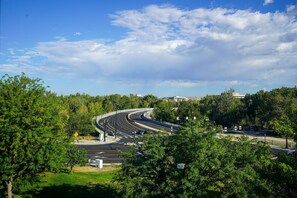 A multi-lane road with a roundabout, surrounded by greenery and buildings in the background. - Holiday Inn Express Boise - University Area by IHG (Boise)