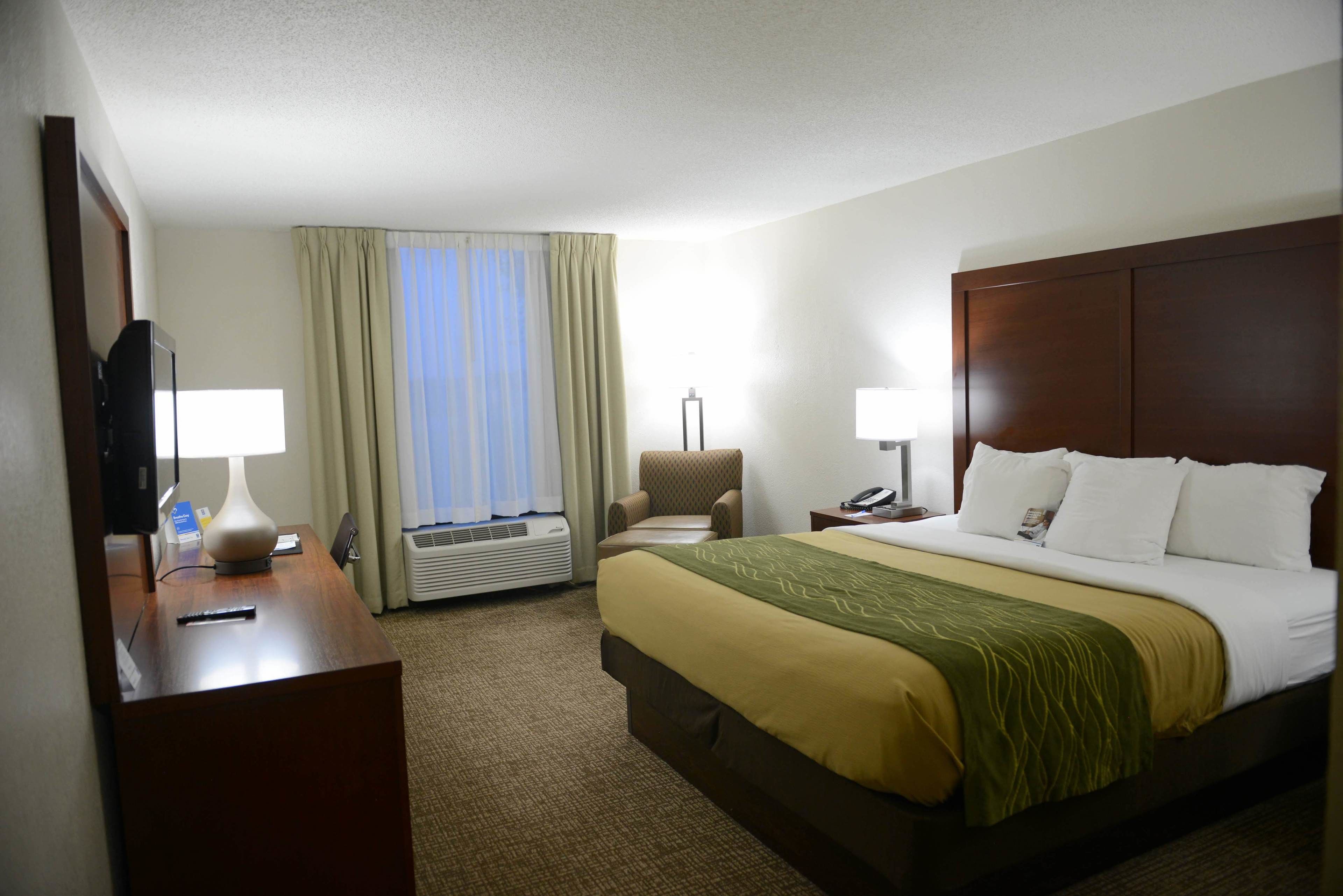 premium bedding, desk, laptop workspace, blackout curtains