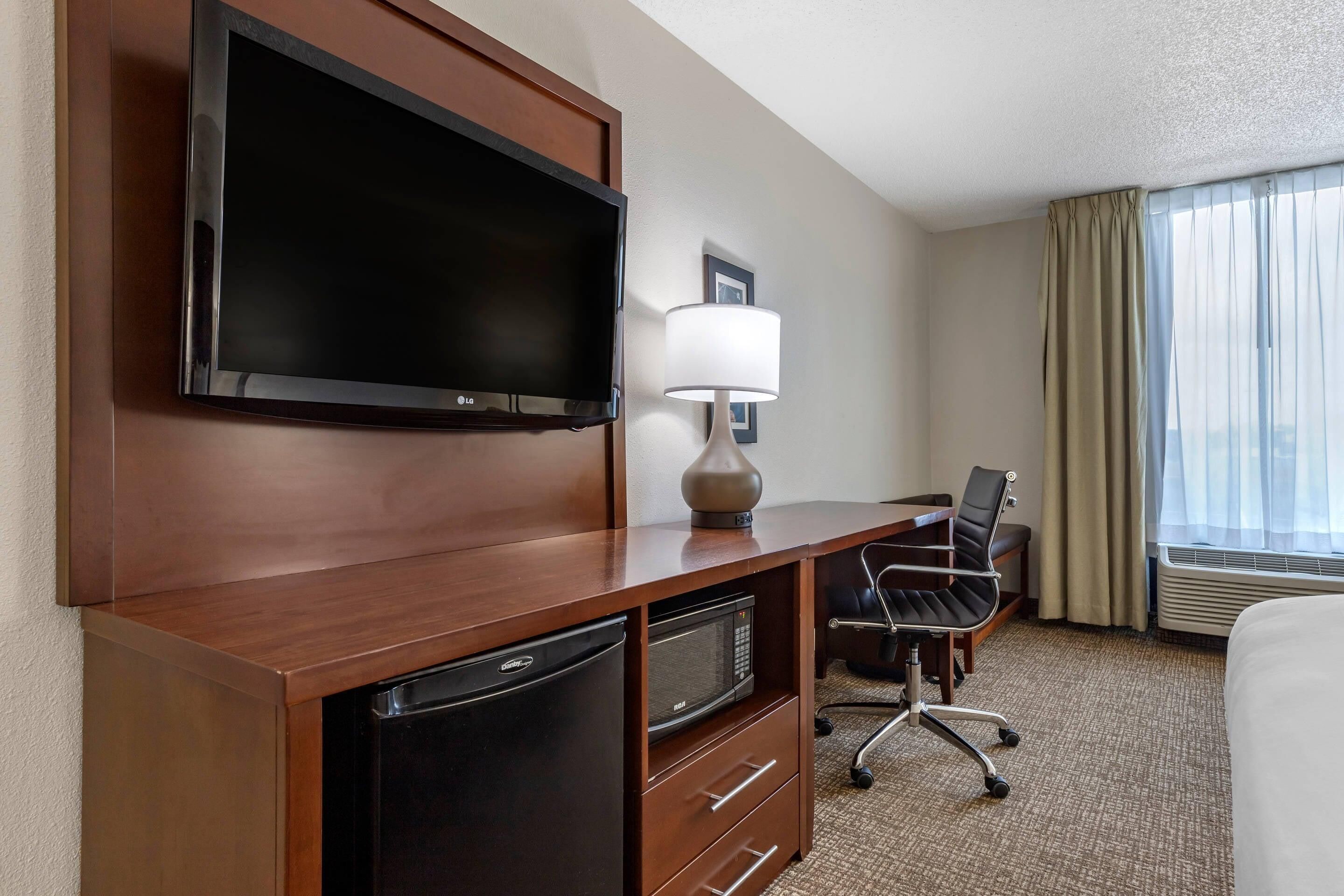 premium bedding, desk, laptop workspace, blackout curtains