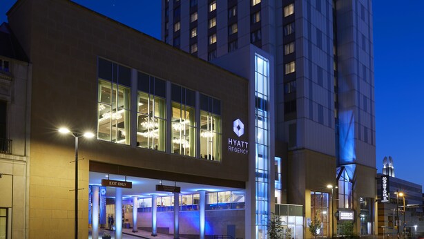 A modern hotel entrance with a clear "EXIT ONLY" sign, a visible "HYATT" logo, and a well-lit facade. - Hyatt Regency Rochester (Rochester)