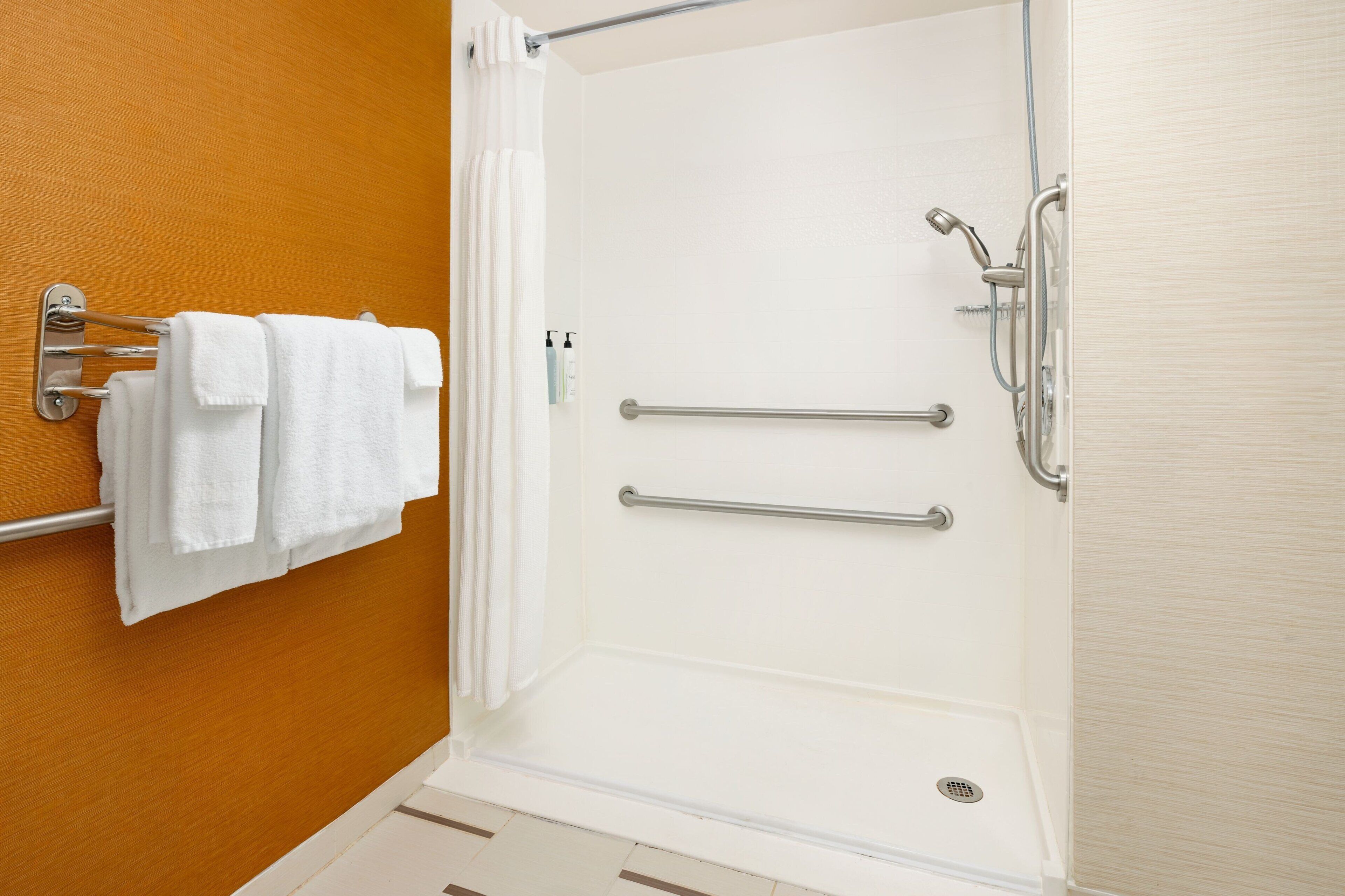 combined shower/bathtub, hair dryer, towels, soap