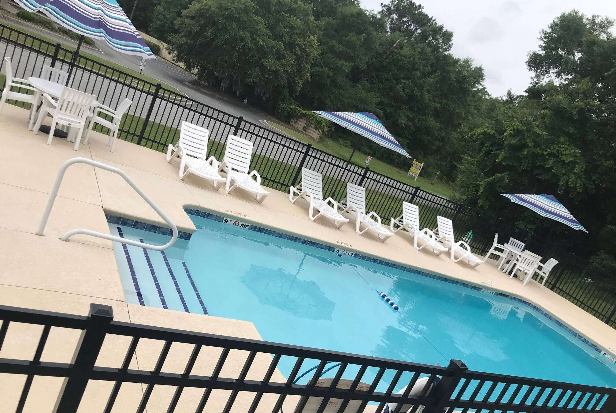 Seasonal outdoor pool, open 8:00 AM to 10:00 PM, pool umbrellas