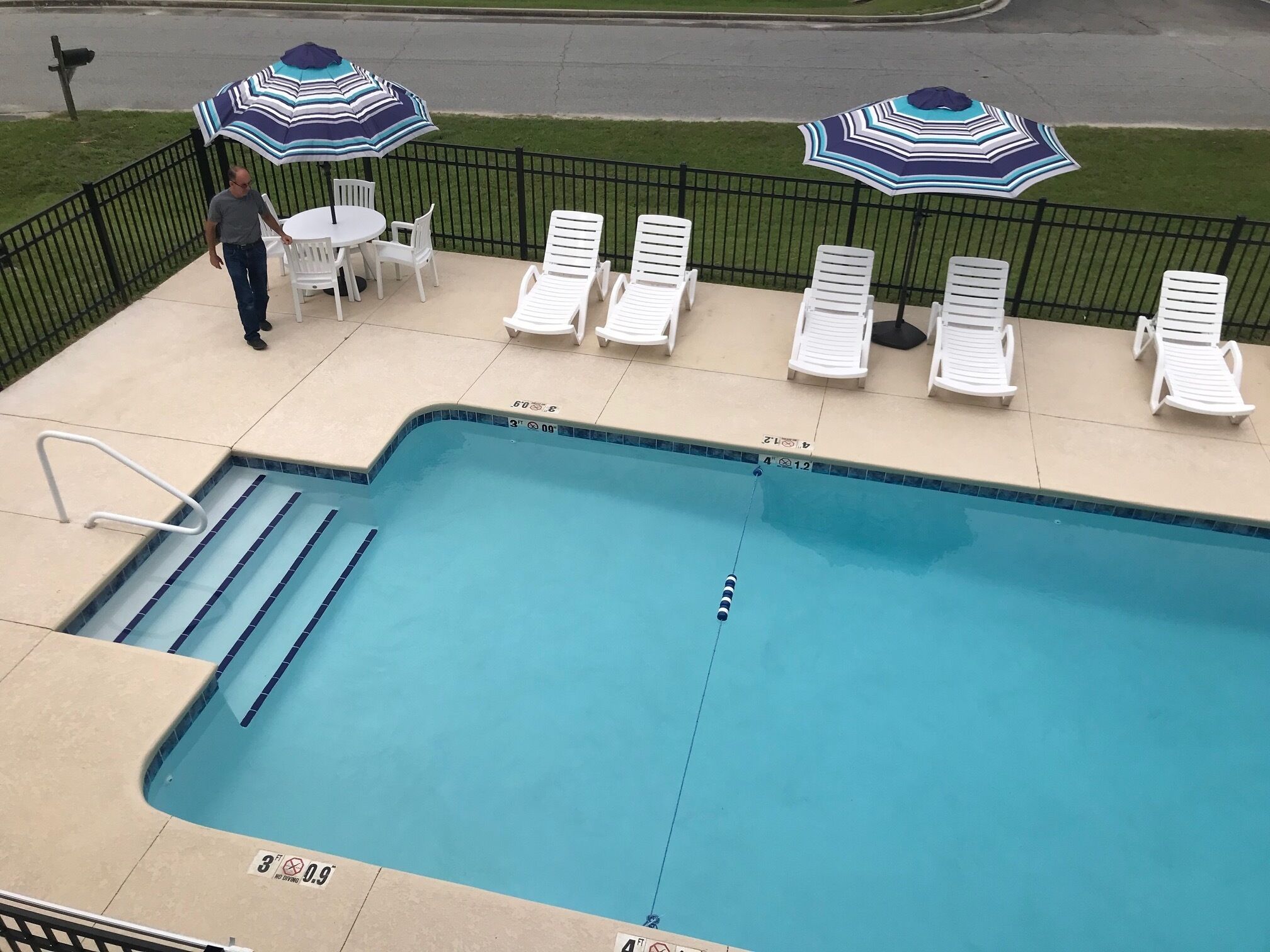 seasonal outdoor pool, open 8:00 am to 10:00 pm, pool umbrellas