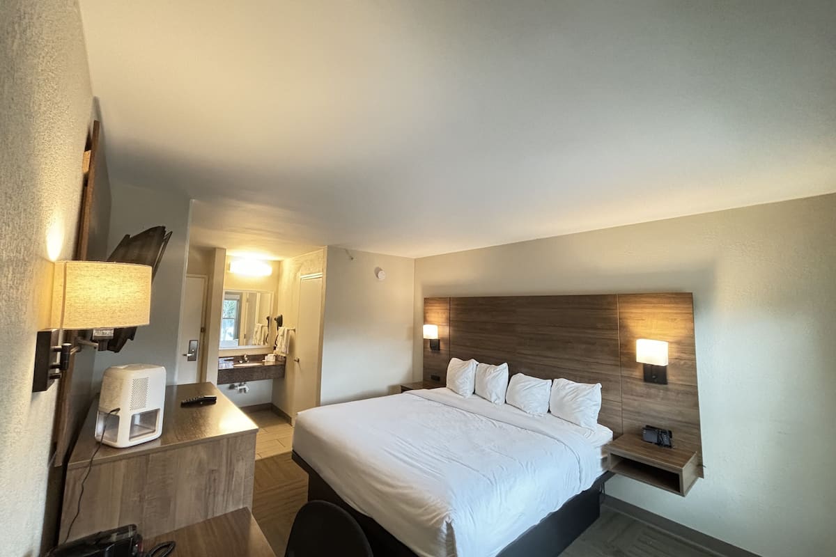 room, 1 king bed, non smoking | desk, blackout curtains, iron/ironing board, free wifi