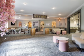 A hotel lobby with a bar area, seating arrangements, and a sign reading 'CASK & SOUNDT'. - DoubleTree by Hilton Southampton (Southampton)
