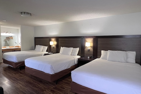 Family Room, 3 Queen Beds | Iron/ironing board, free cribs/infant beds, rollaway beds, free WiFi