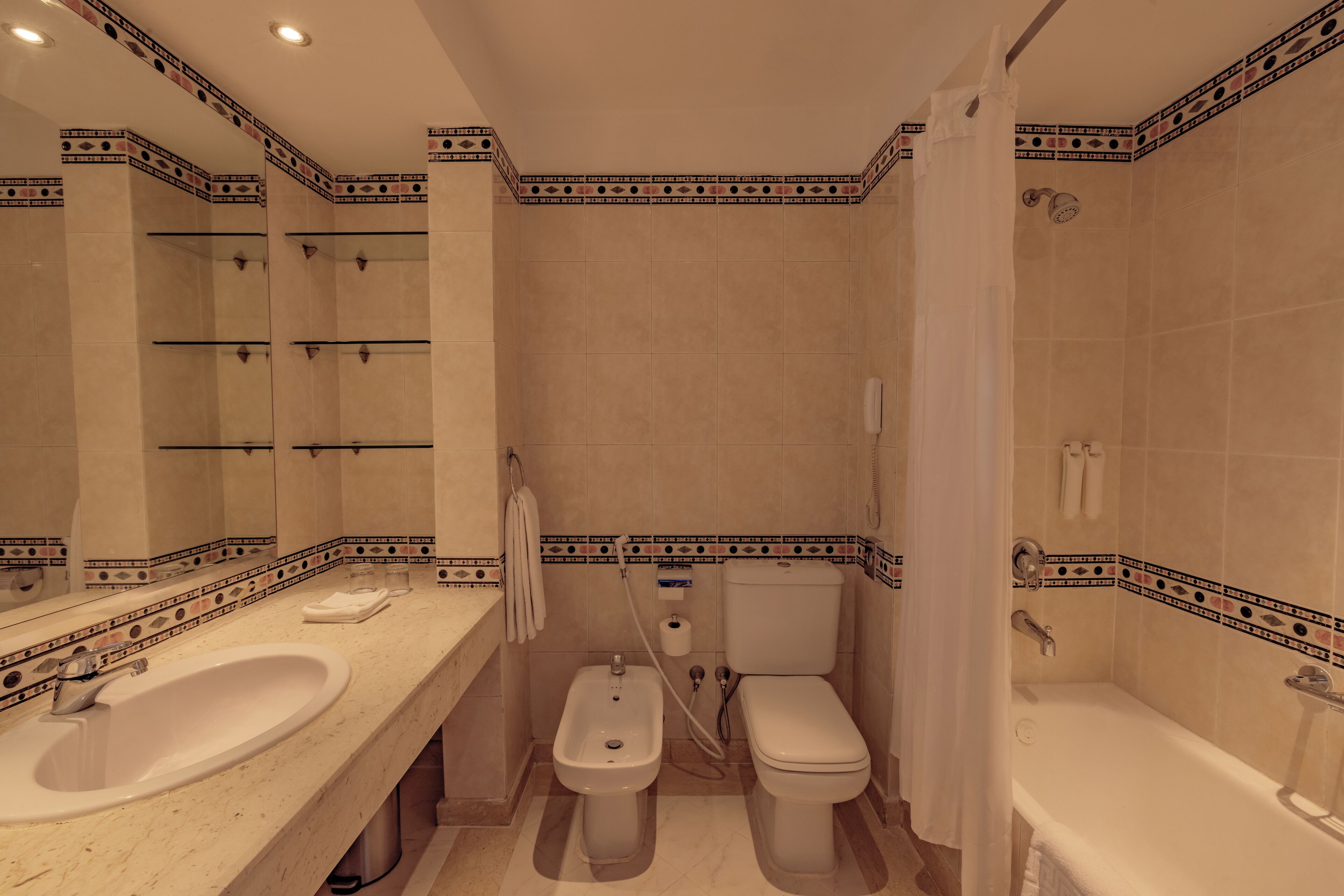 superior room, pool view (queen or twin) | bathroom | combined shower/bathtub, eco-friendly toiletries, hair dryer, towels