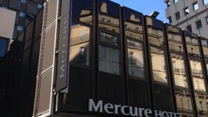 The exterior of the Mercure Hotel with a modern facade, large windows, and a visible sign. - Mercure Marseille Centre Vieux Port (Marseille)