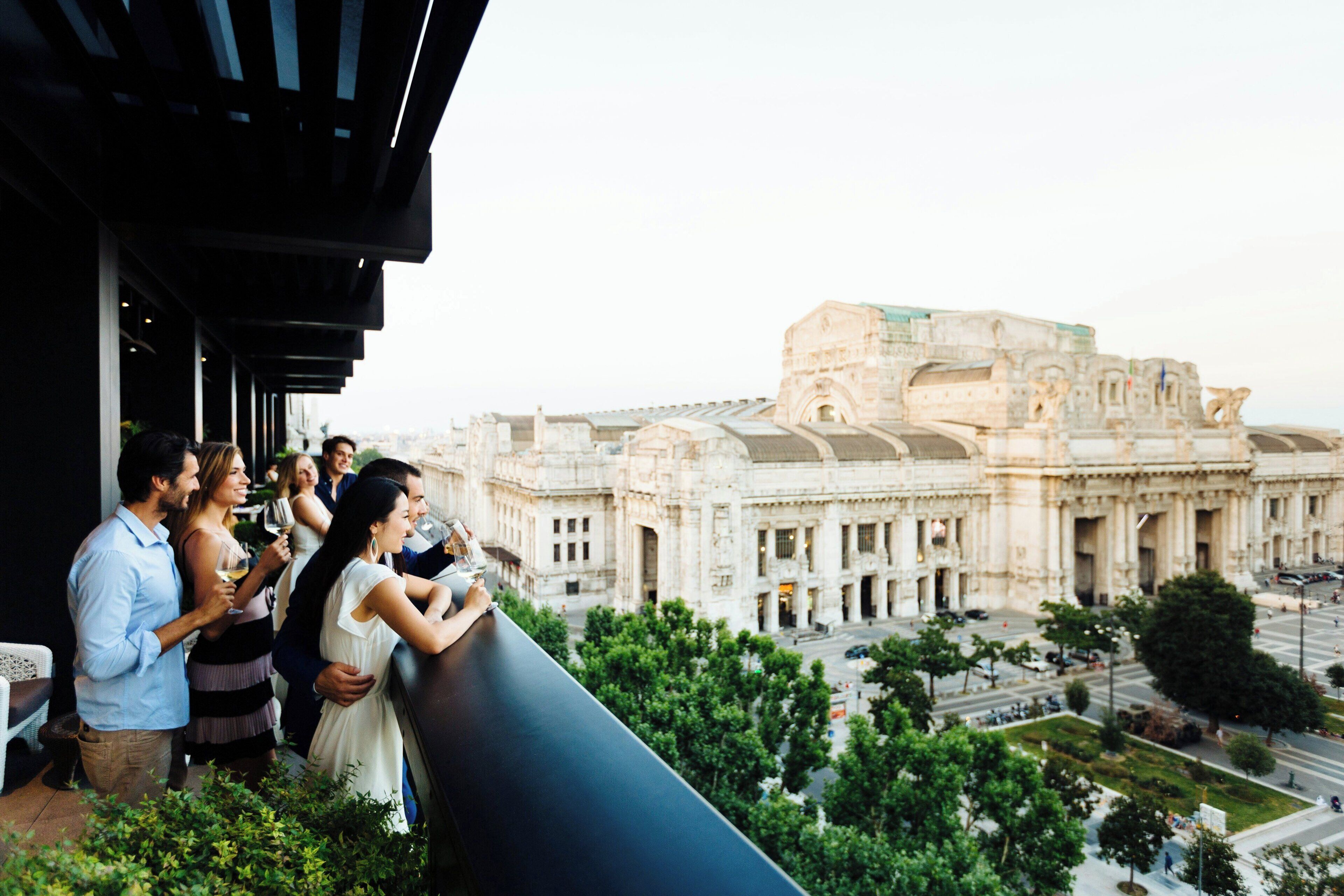 A balcony overlooking a historic building with classical architecture.